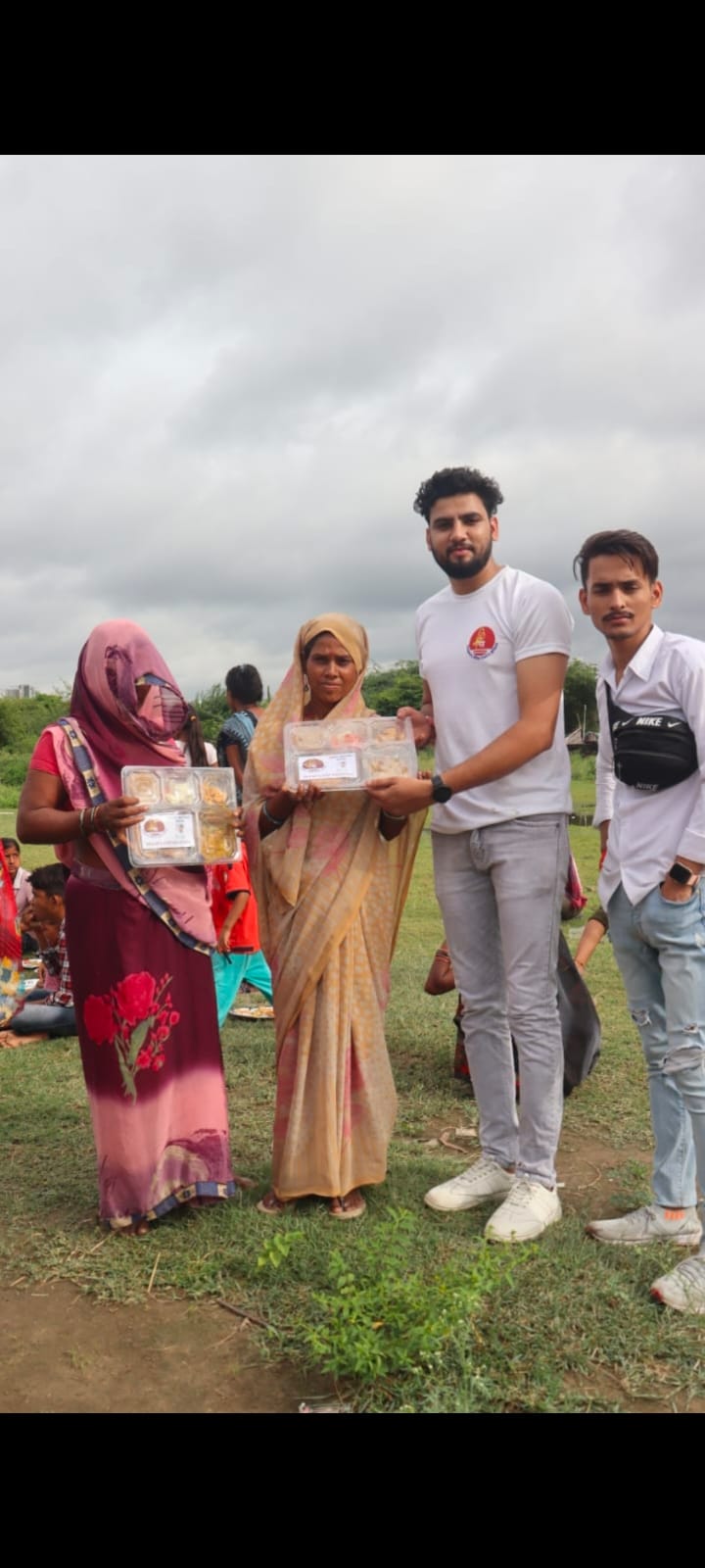 Volunteers distributing food during hunger relief drive